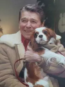 Ronald Reagan and Rex cuddling